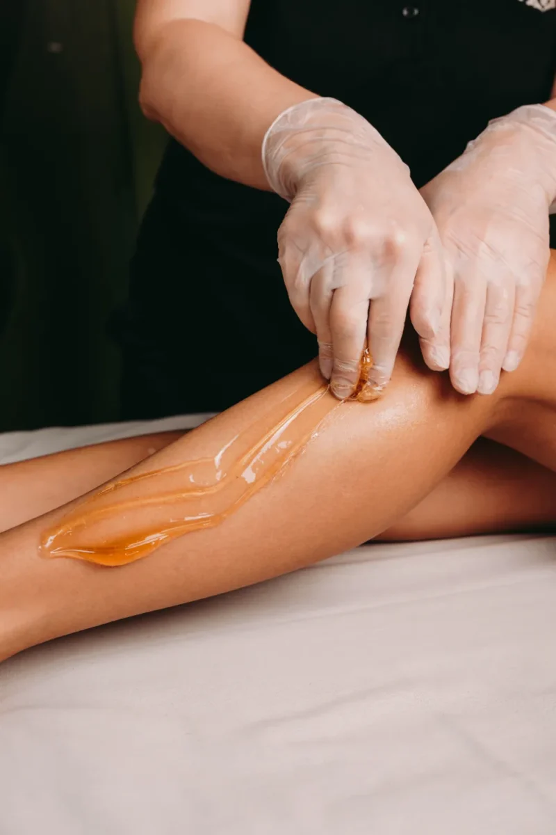 sugaring procedure legs done by spa specialist procedure salon