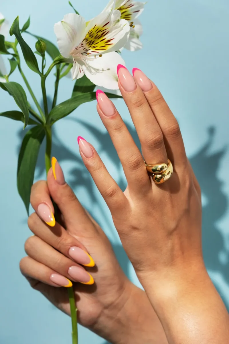 woman showing her nail art fingernails with flower